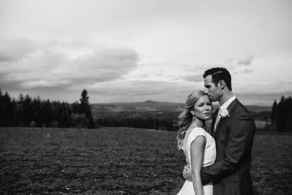 A wedding photo with the Cascade mountains at Home Place Farms