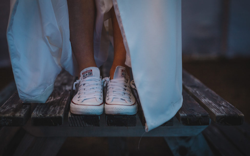 Bride wearing converse at her wedding