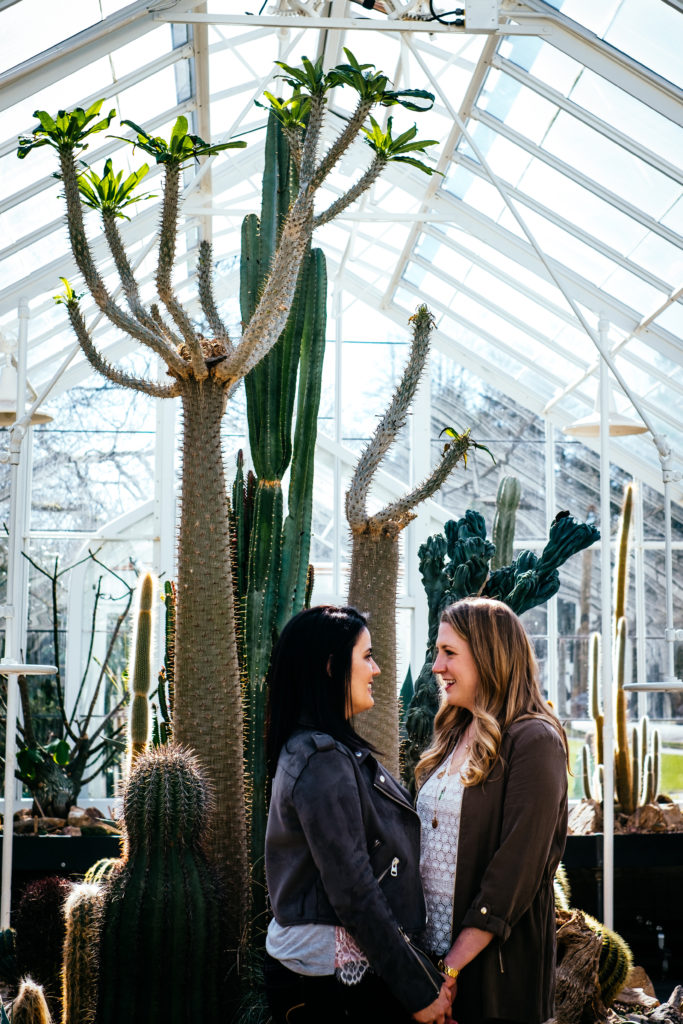 Same sex engagement photo in the Volunteer Park Conservatory