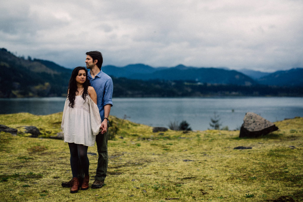 Mossy engagement photo with views of the Columbia River Gorge