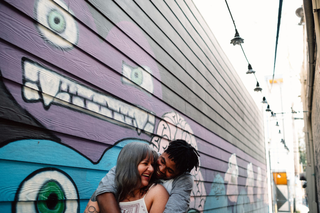 Wall art engagement photo on Alberta Street in Portland, OR