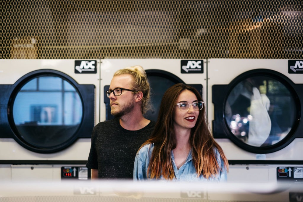 Couples photo in a laundry mat in Portland Oregon