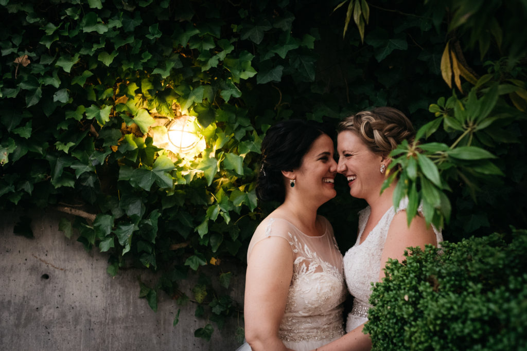 Two brides wedding photo at the Blue Ribbon Culinary Center in Seattle, Washington
