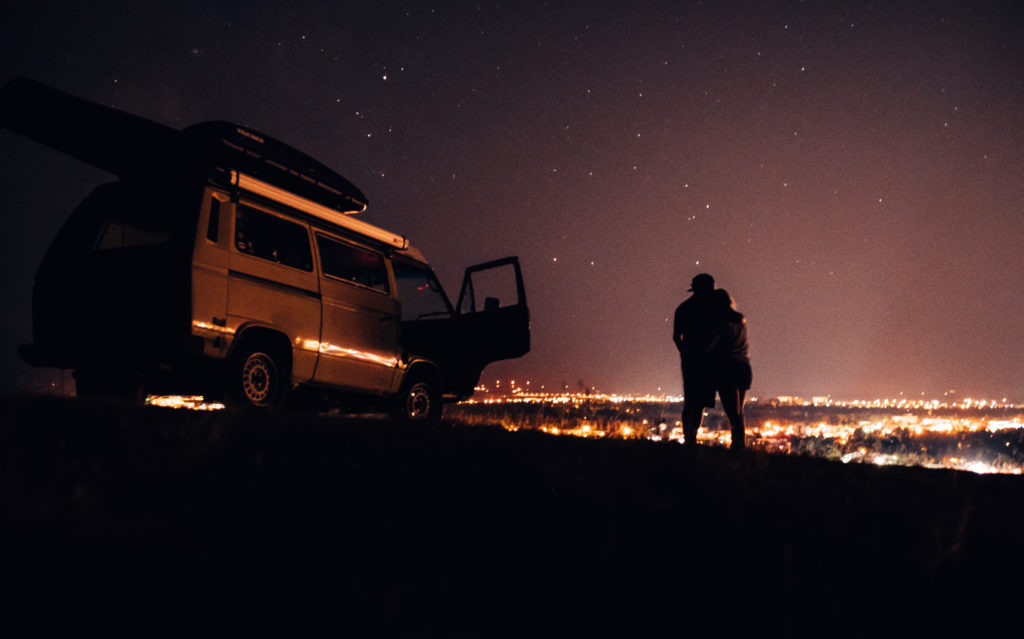 Night time engagement photo with a VW Vanagon in Bozeman, Montana