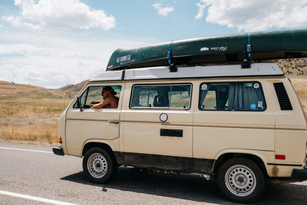 Photo of a VW Vanagon driving in Montana