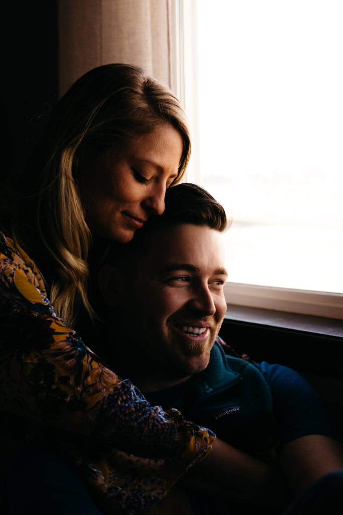 A couples photo using natural window light in their home