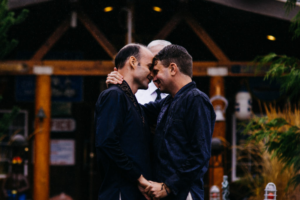 Same sex wedding photo in Lincoln City, OR at the Historic Anchor Inn