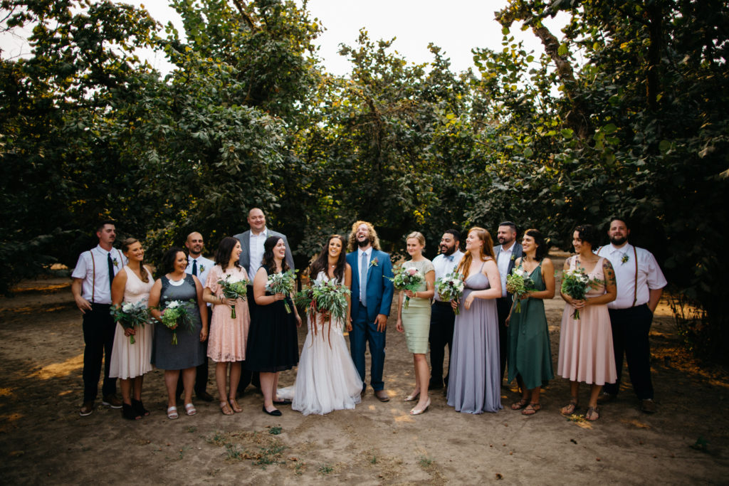 Wedding party photo with mismatched dresses