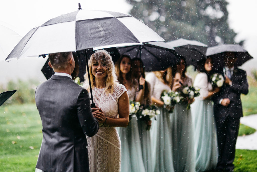 Wedding ceremony in the rain at Scholls Valley Lodge in Hillsboro, OR