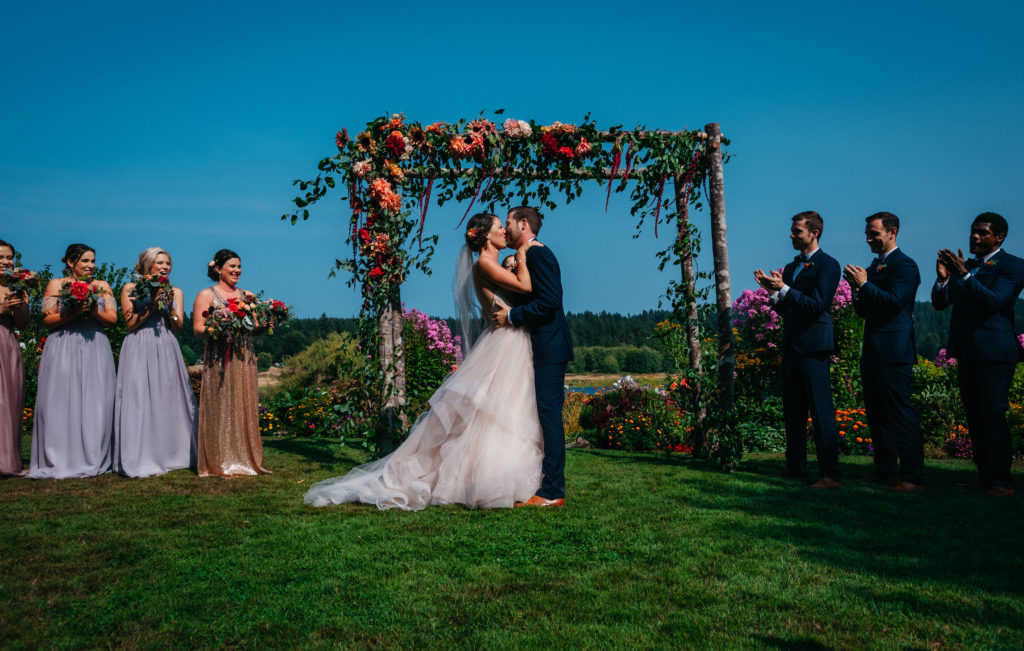 First kiss wedding photo at Fireseed Catering in Langley, Washington