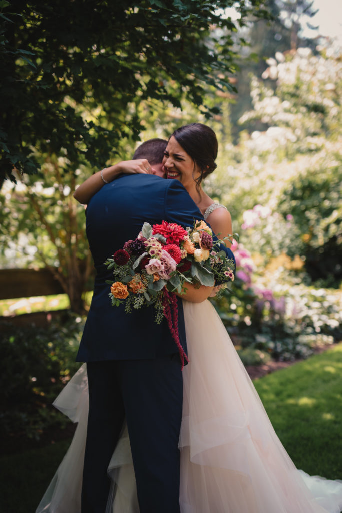 A bride and grooms first look at Fireseed catering on Whidbey Island in Langley, Washington