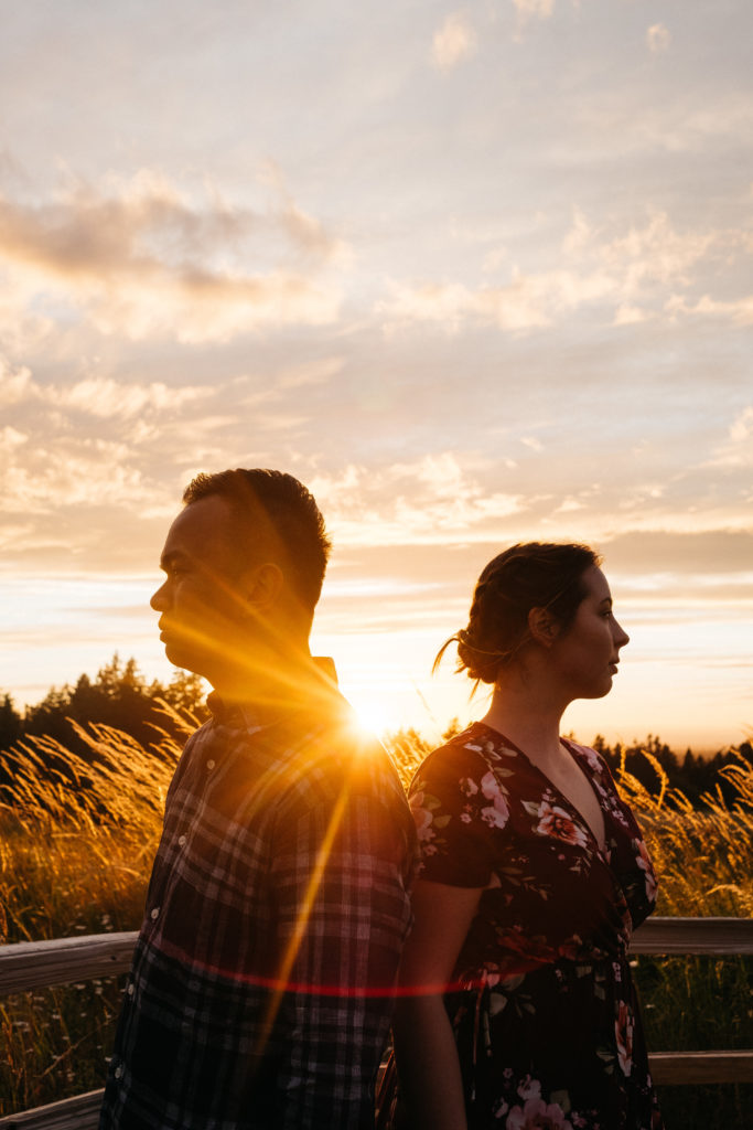 An artistic portrait with sun flares during the couples engagement photos