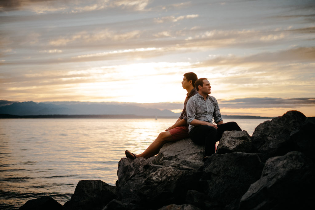Same sex engagement photo with the cascade mountains in Seattle, WA