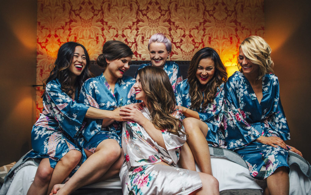 Getting ready wedding photo of a bride and her bridesmaids in kimono robes at the Sentinel Hotel in Portland, Oregon