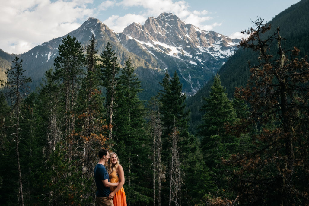 Engagement photo with the cascade mountains in North Cascades National Park