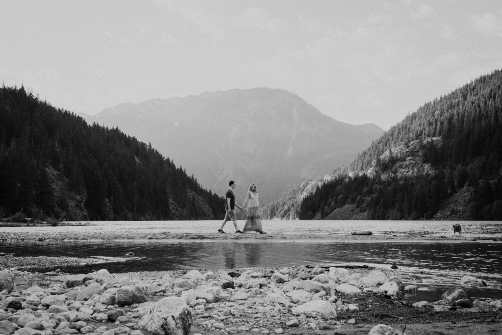 Engagement photo on the beach of Diablo Lake in North Cascades National Park