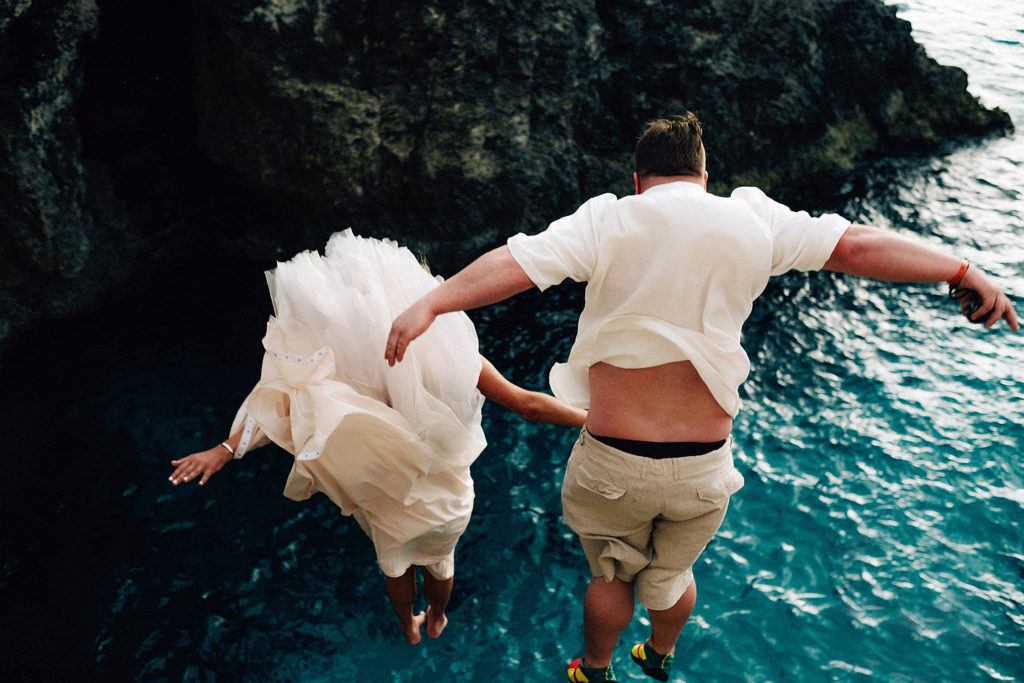 Bride and Groom cliff jumping at Ricks Cafe in Negril, Jamaica