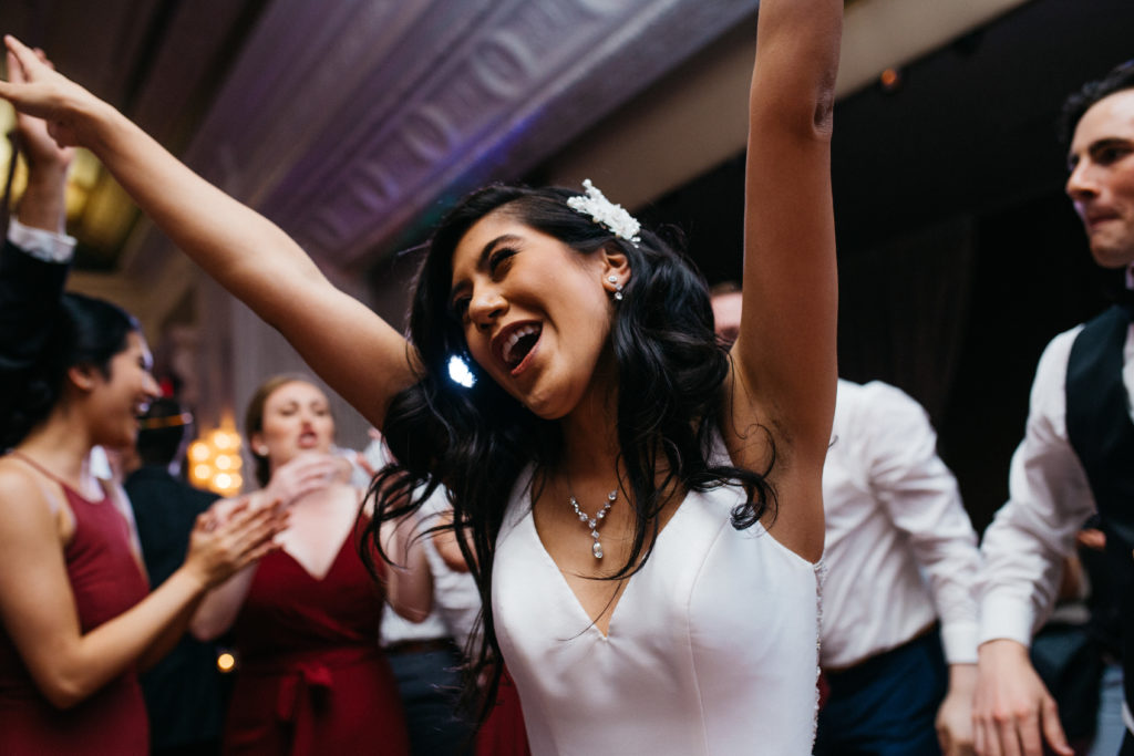 Bride dancing during her reception at the Sentinel Hotel in Portland, Oregon