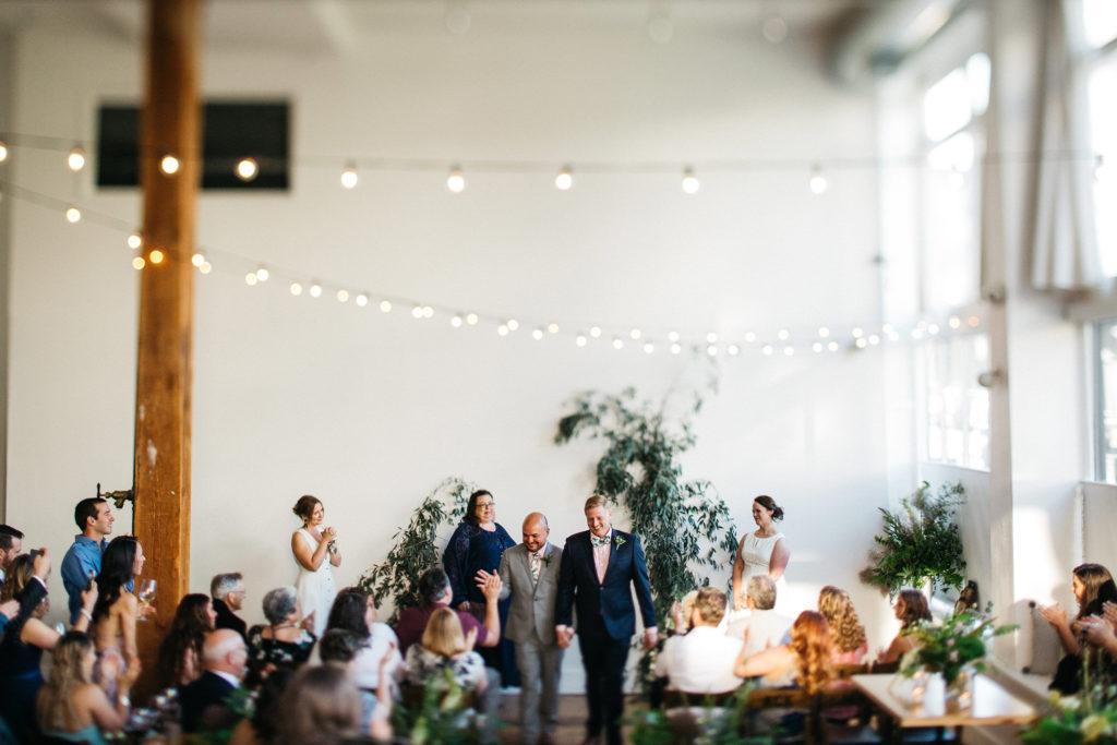 Photo of a same sex wedding ceremony at the Cleaners in the Ace Hotel in Portland, Oregon