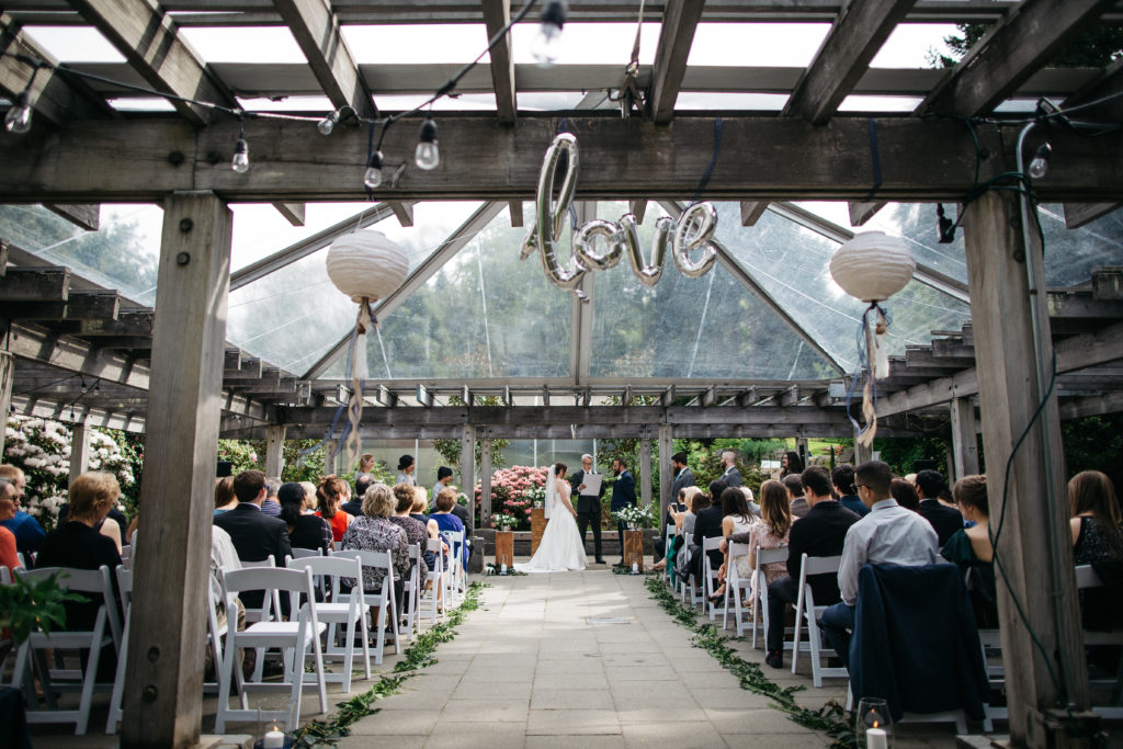 Wedding ceremony at Wisteria Hall at the UW Botanic Gardens in Seattle, Washington