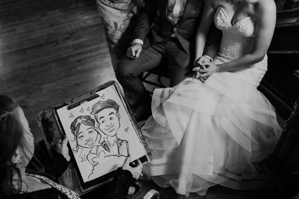 caricature artist at a wedding at Thornewood Castle in Lakewood, Washington