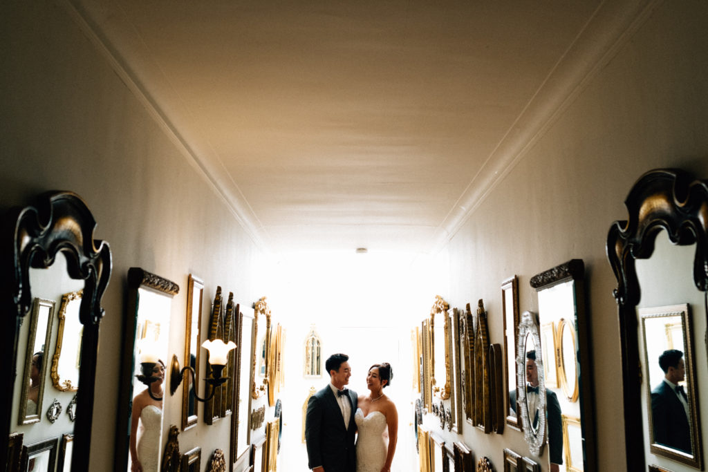 Wedding photo in the hall of mirrors at Thornewood Castle in Lakewood, Washington