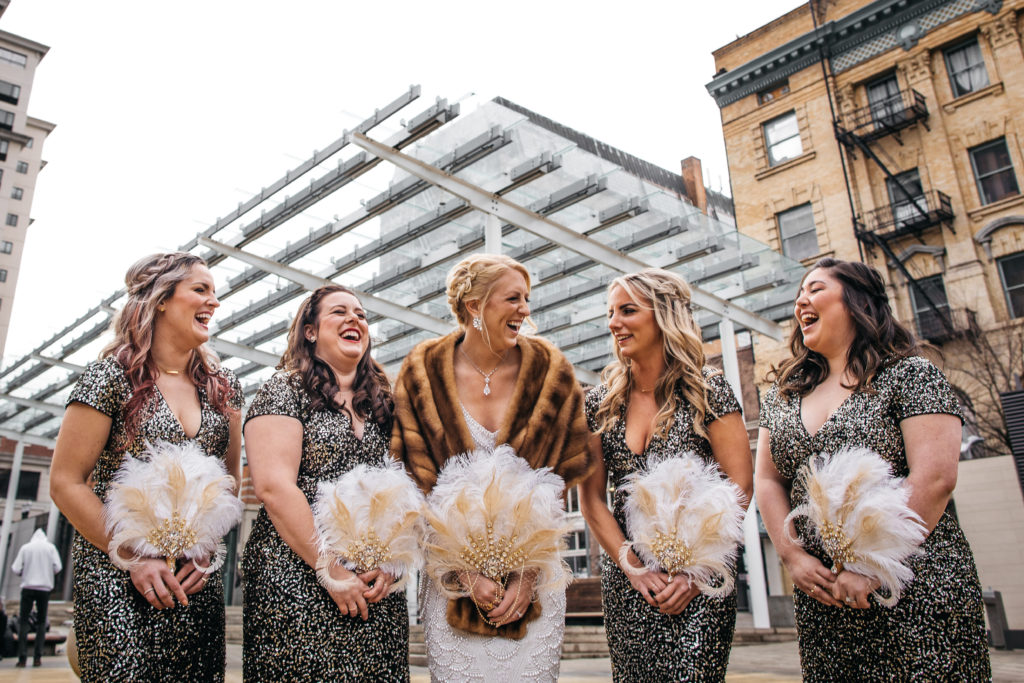 Great Gatsby themed brides maid dresses with feather bouquets