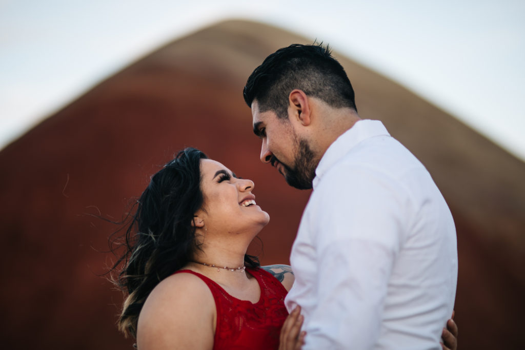 A photo of a bride and groom at the Painted Hills National Monument