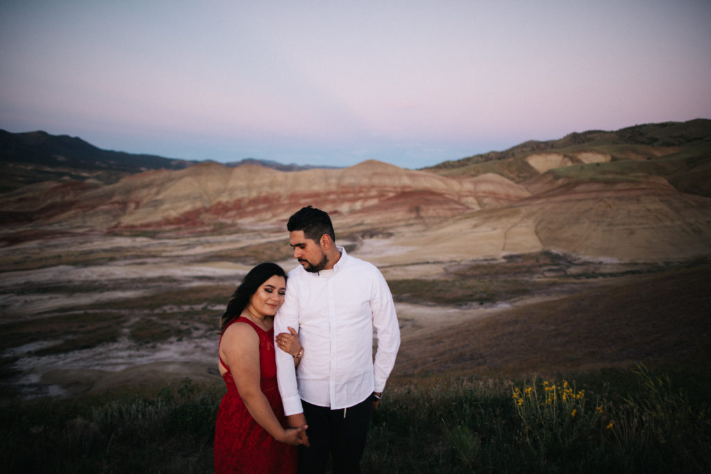 Engagement photo at sunset at the Painted Hills