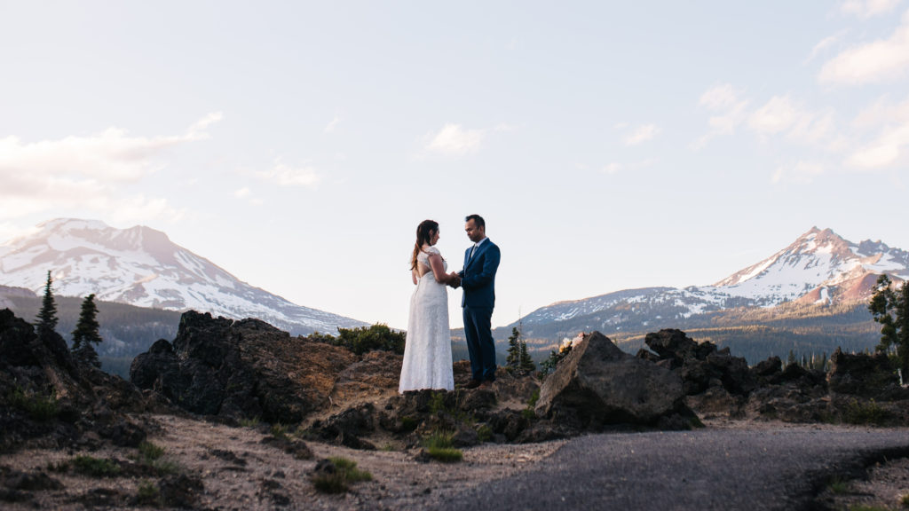 Sunset elopement photo at Sparks lake with views of South Sister, Mount Bachelor, and Broken Top mountains