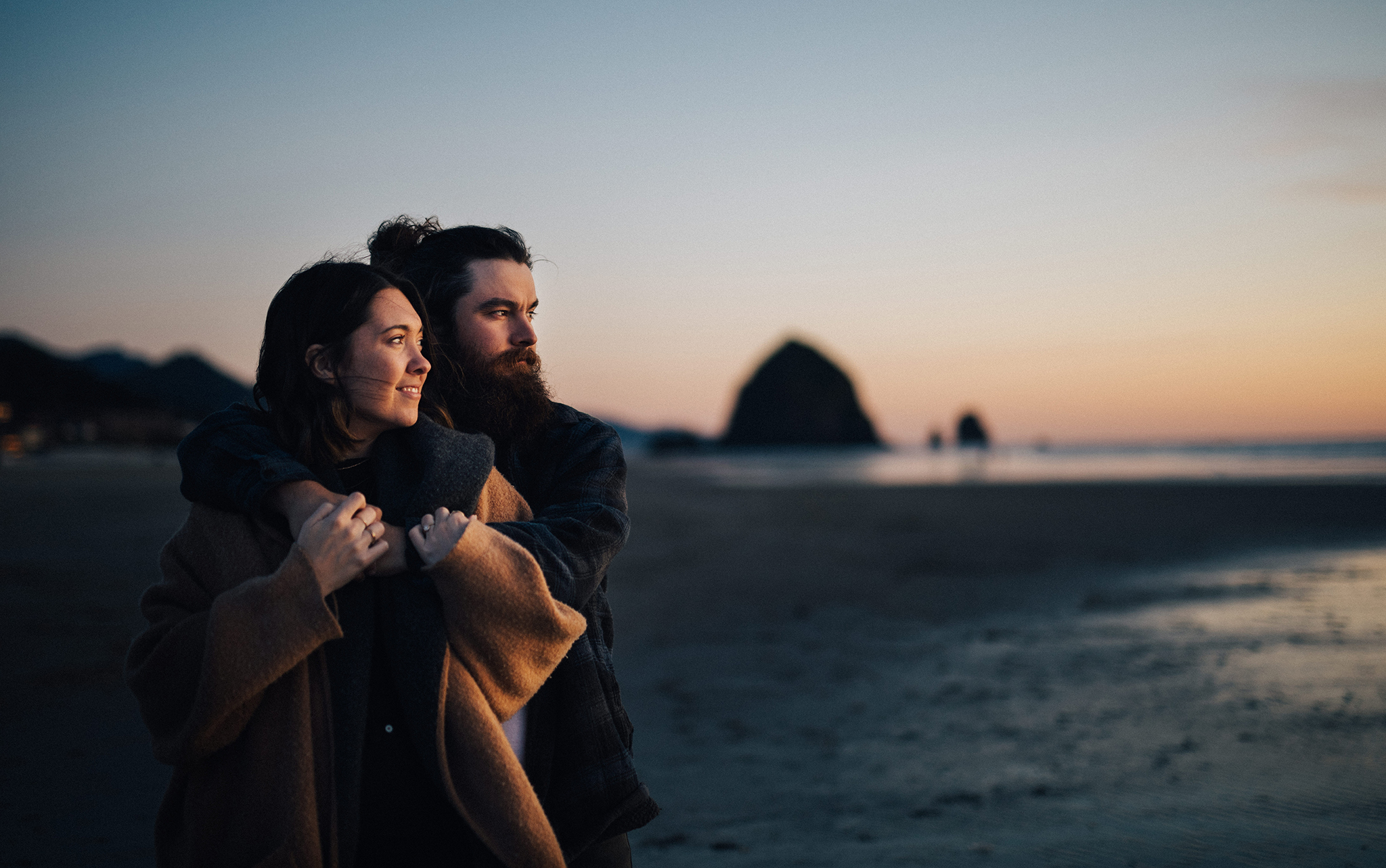 Couples session photos at sunset on Cannon Beach
