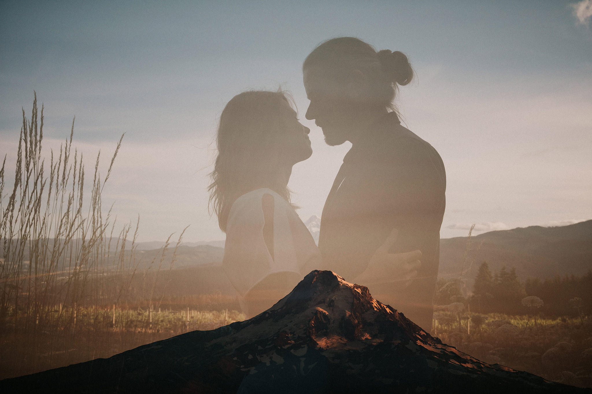 Artistic wedding photo with a double exposure of Mount Hood and the bride and groom