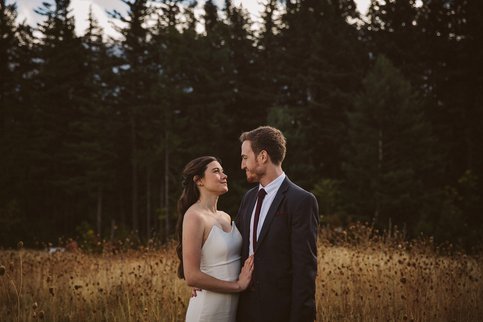 A bride and groom in the fields at Skamania Lodge