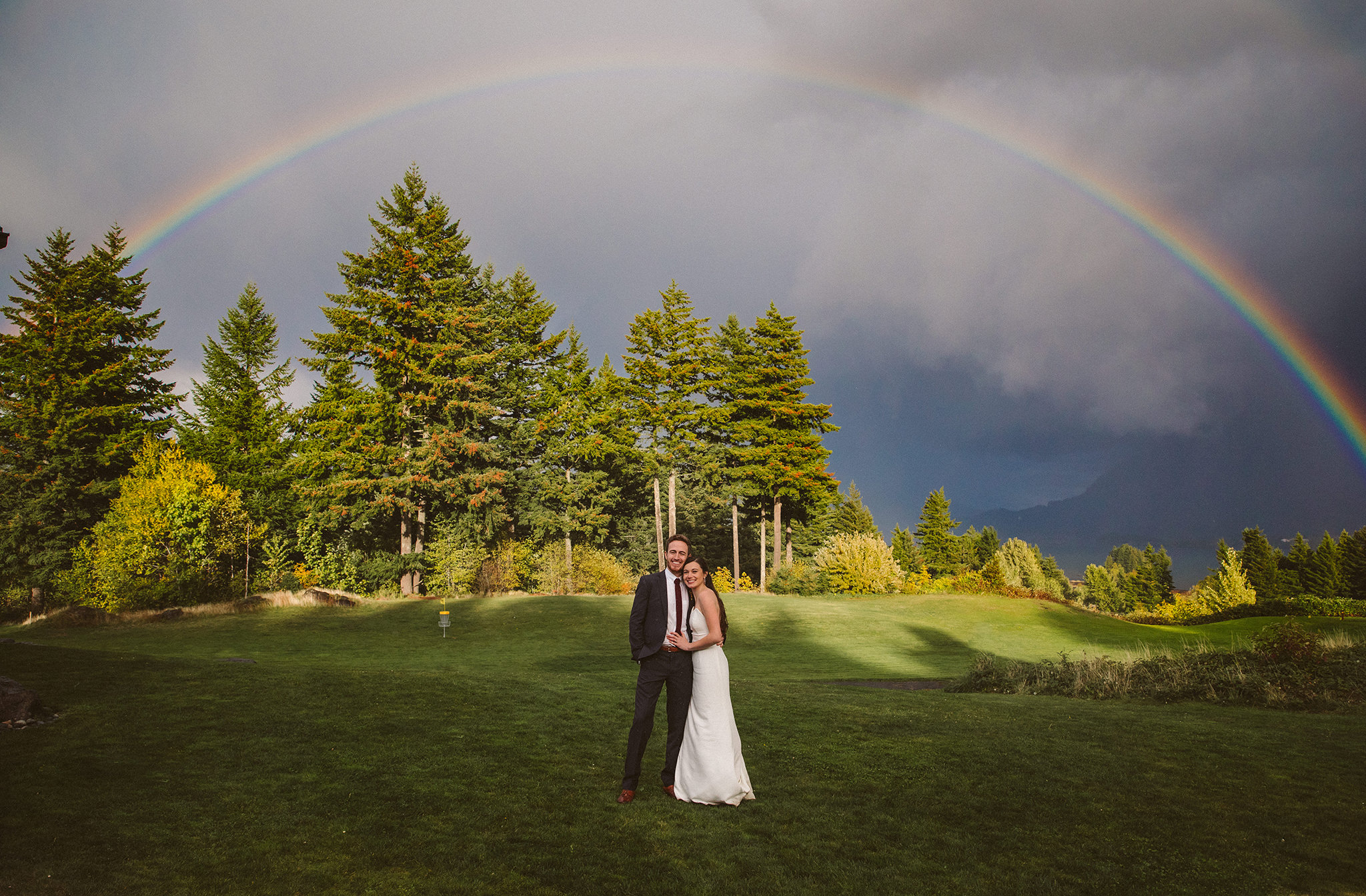 A wedding photo under a rainbow at Skamania Lodge Resort