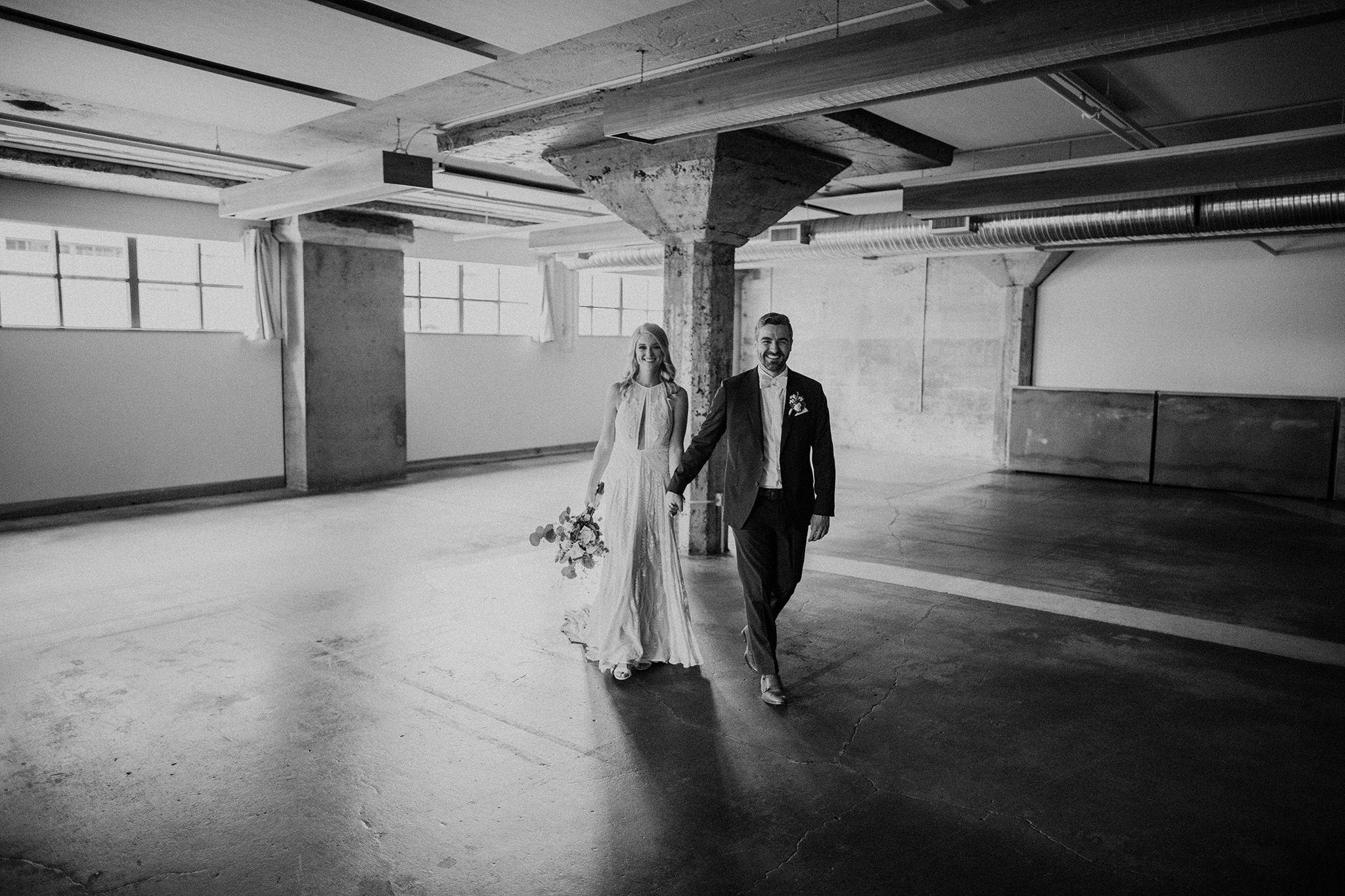 A wedding photo of a bride and groom in the Clubroom at Leftbank Annex Portland wedding venue