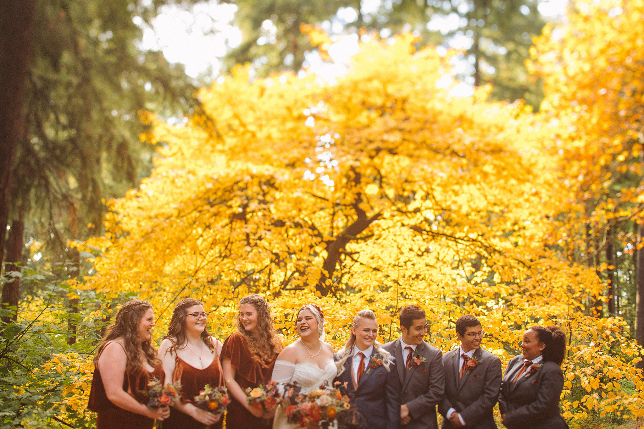 Wedding party photo with fall leaves at Mt Tabor in Portland, Oregon