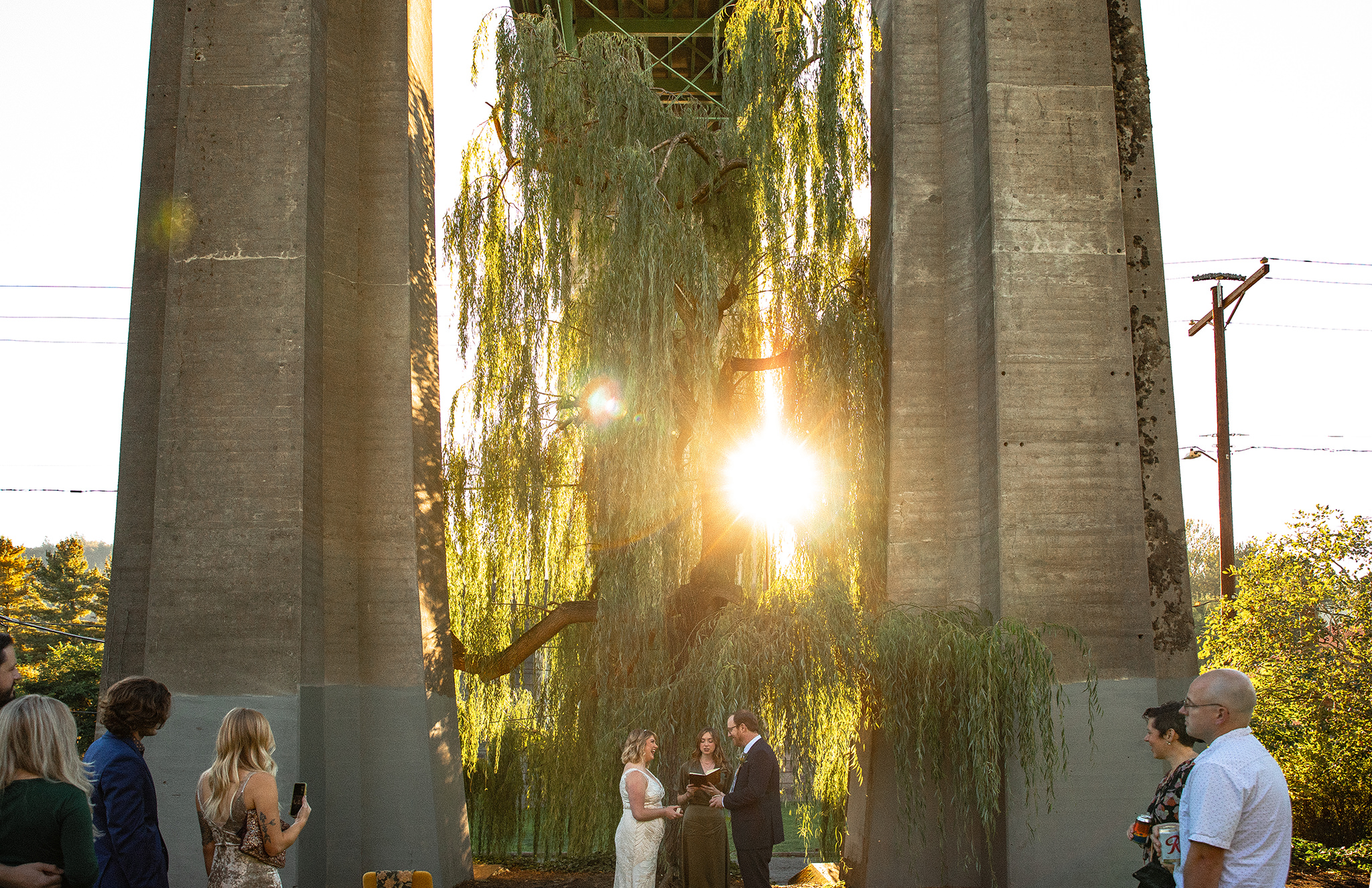 An elopement ceremony at Cathedral Park beneath the St. John's Bridge in Portland, Oregon