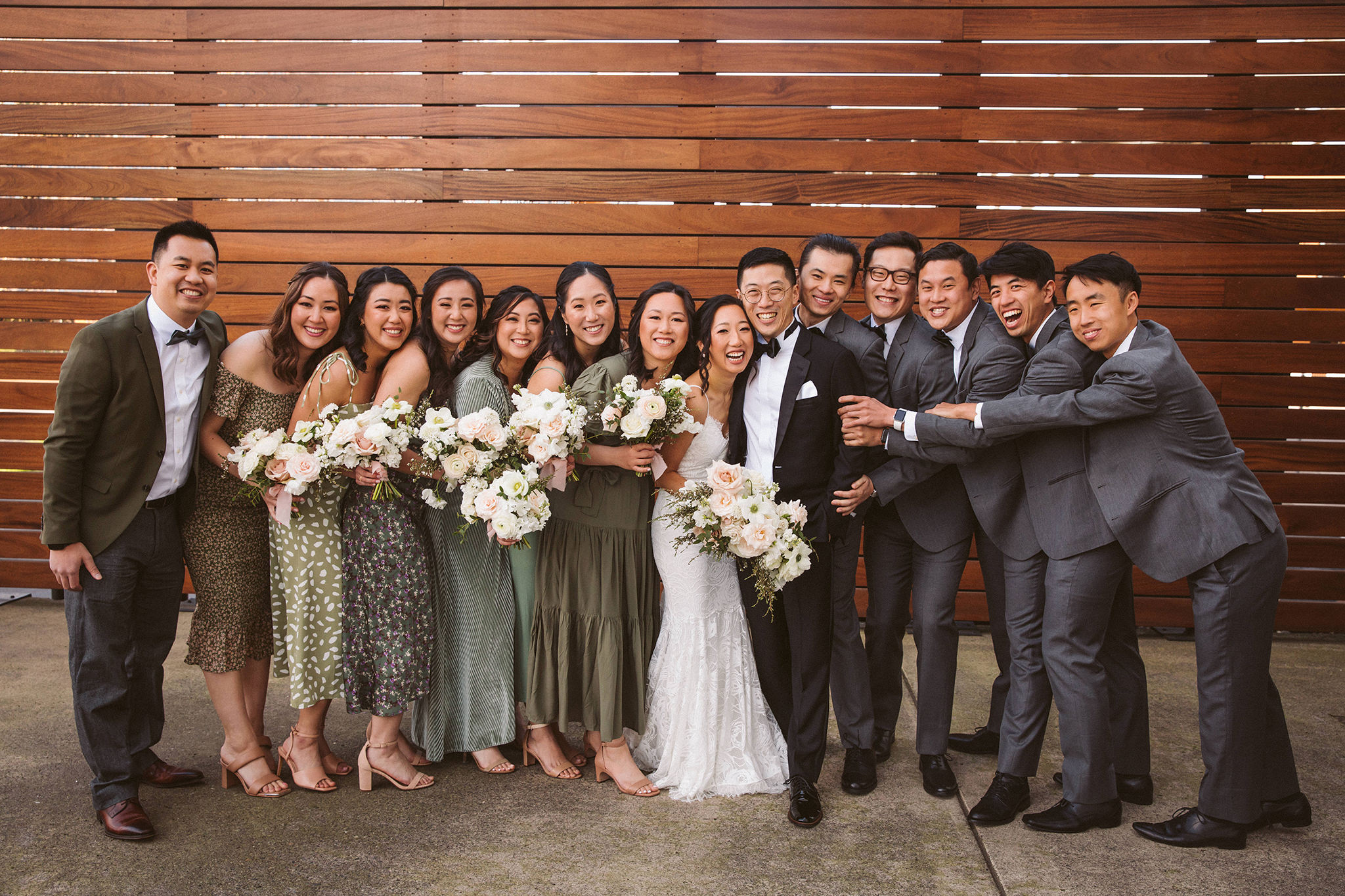 A bride and groom with their wedding party at Castaway in Portland, Oregon