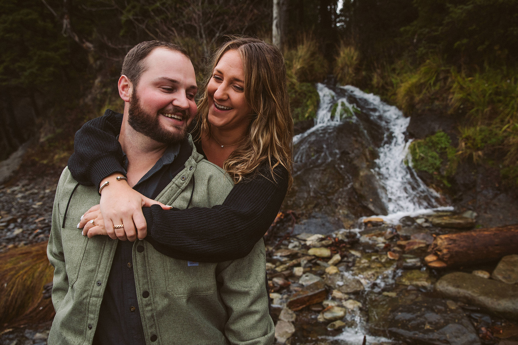 A couple in front of a waterfall in Oregon