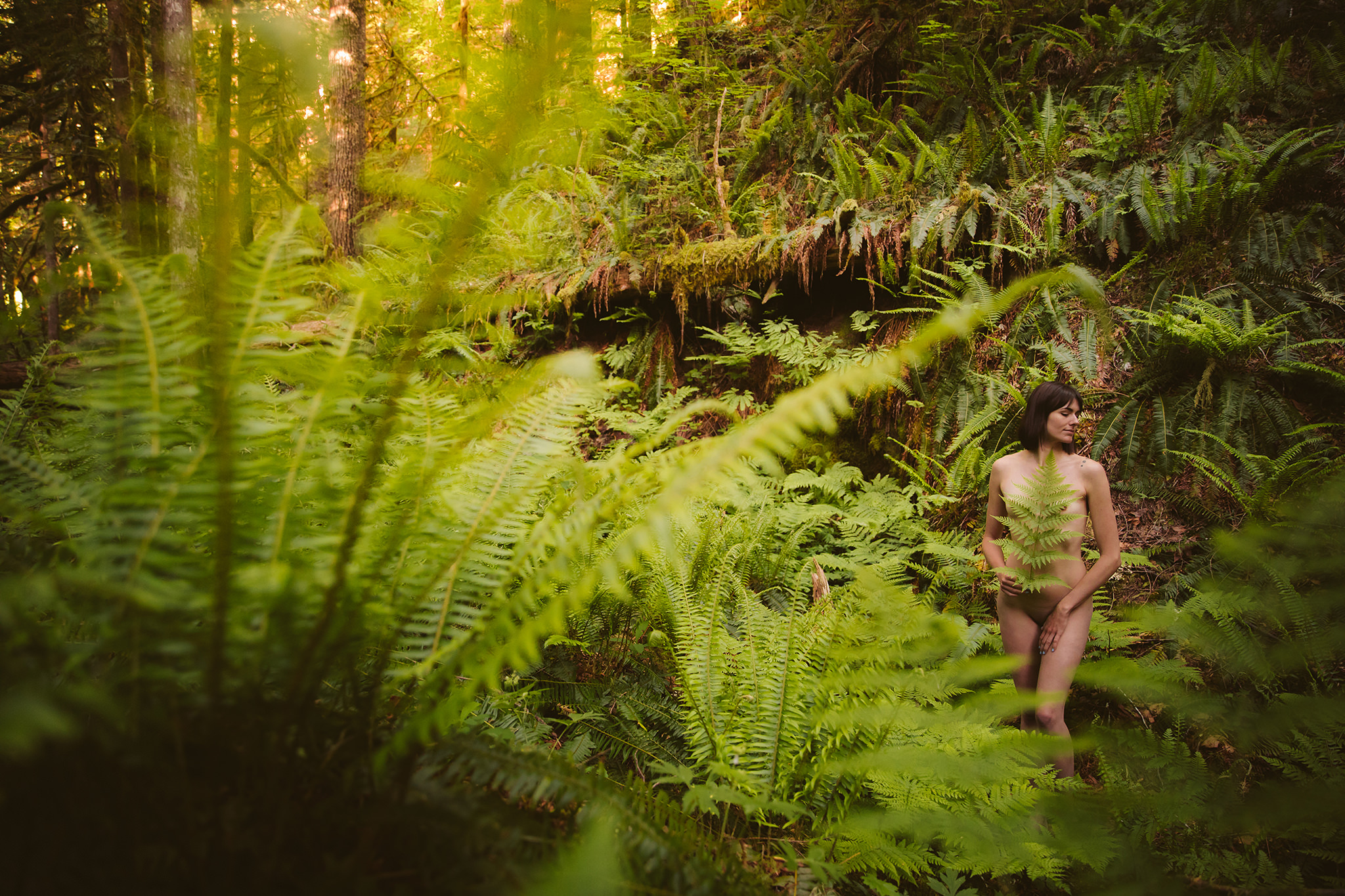 Creative outdoor boudoir photo surrounded by ferns on Mt. Hood in Oregon