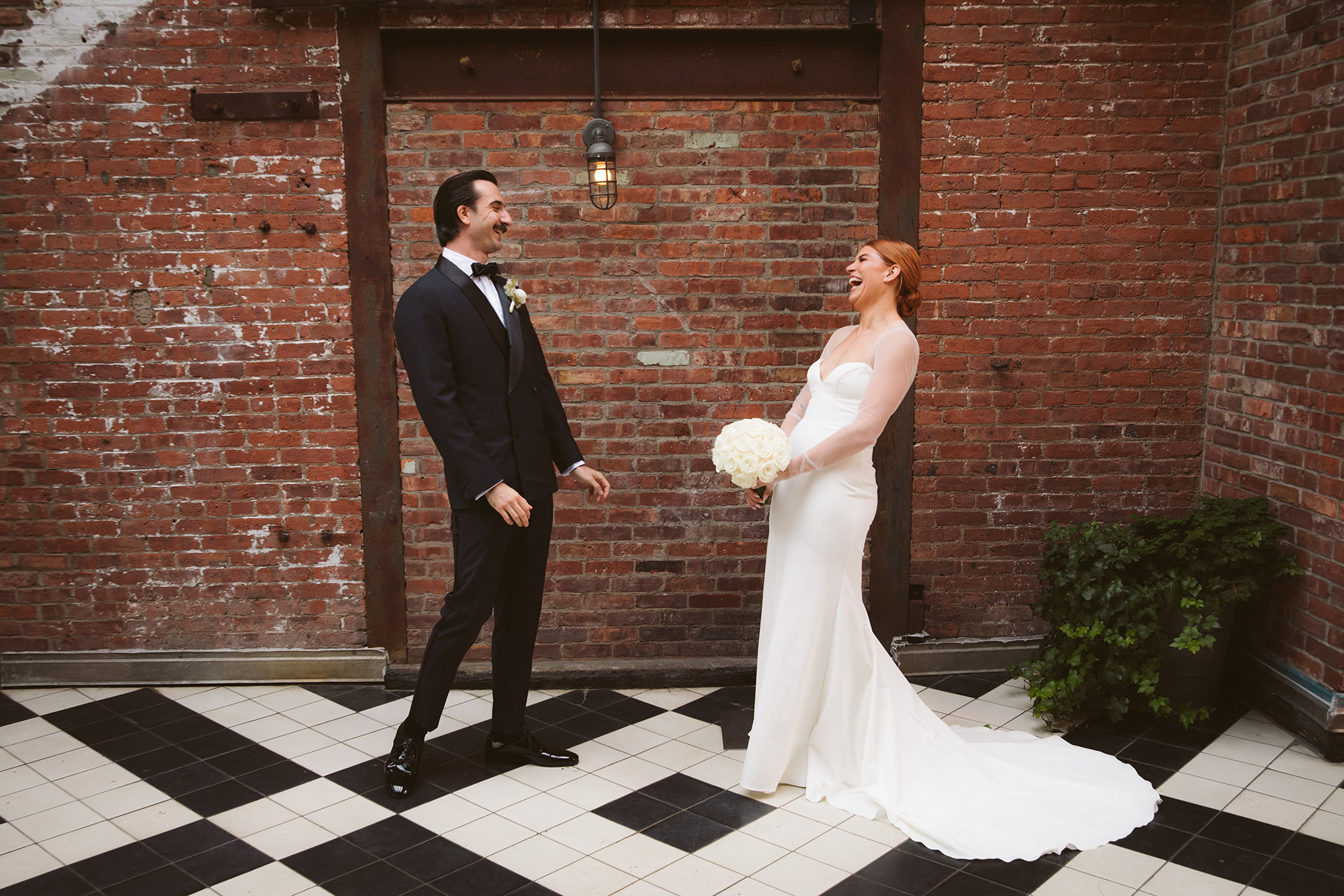 A bride and groom's first look on their wedding day at the Wythe Hotel 