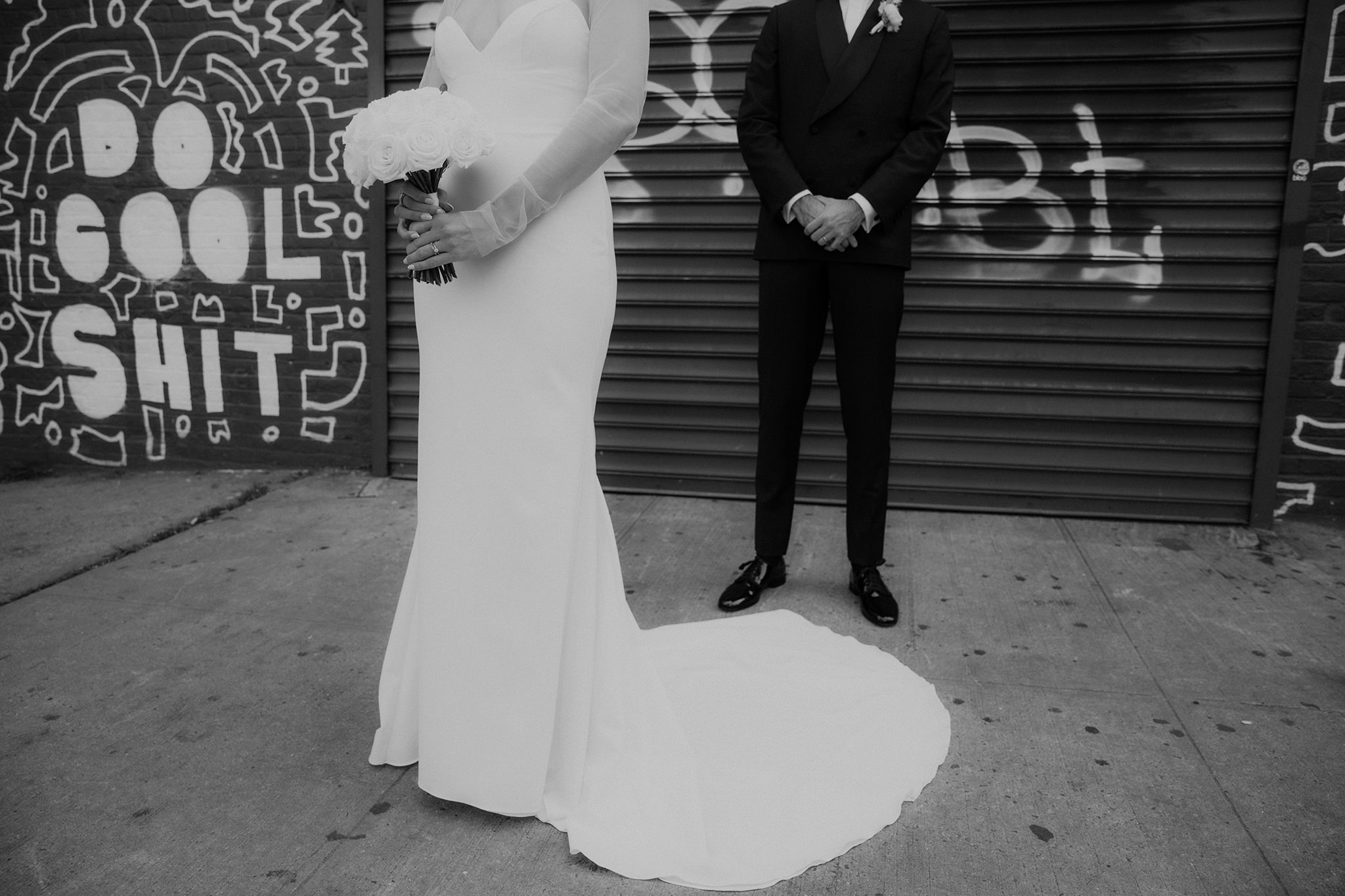 A creative, industrial wedding photo outside of the Wythe hotel in Brooklyn, New York