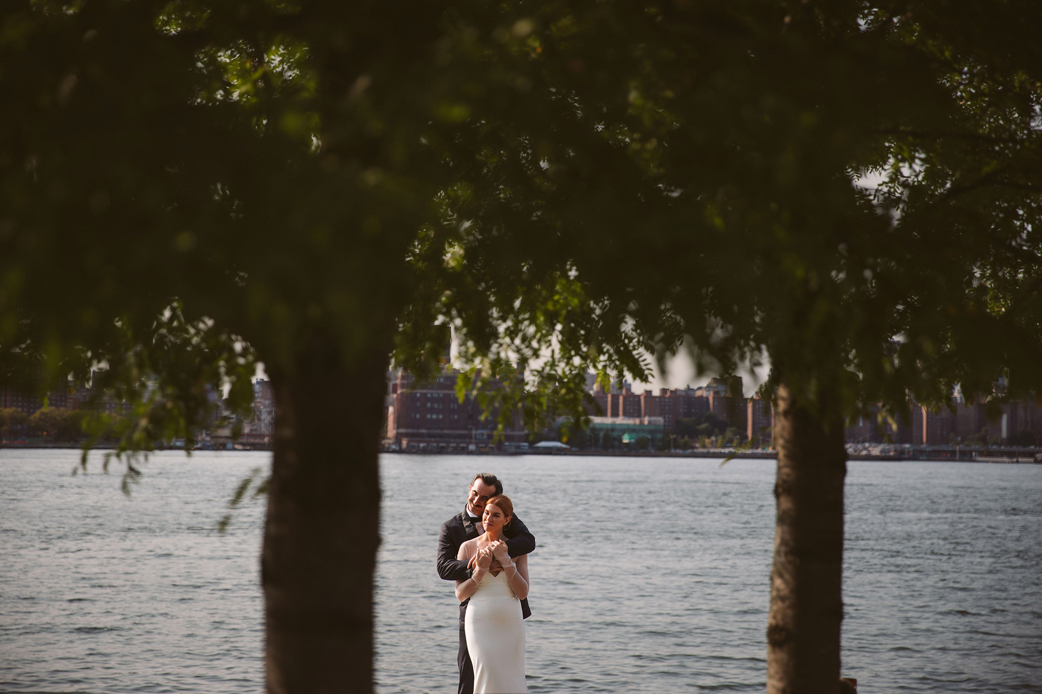 A creative city wedding photo with trees in Williamsburg