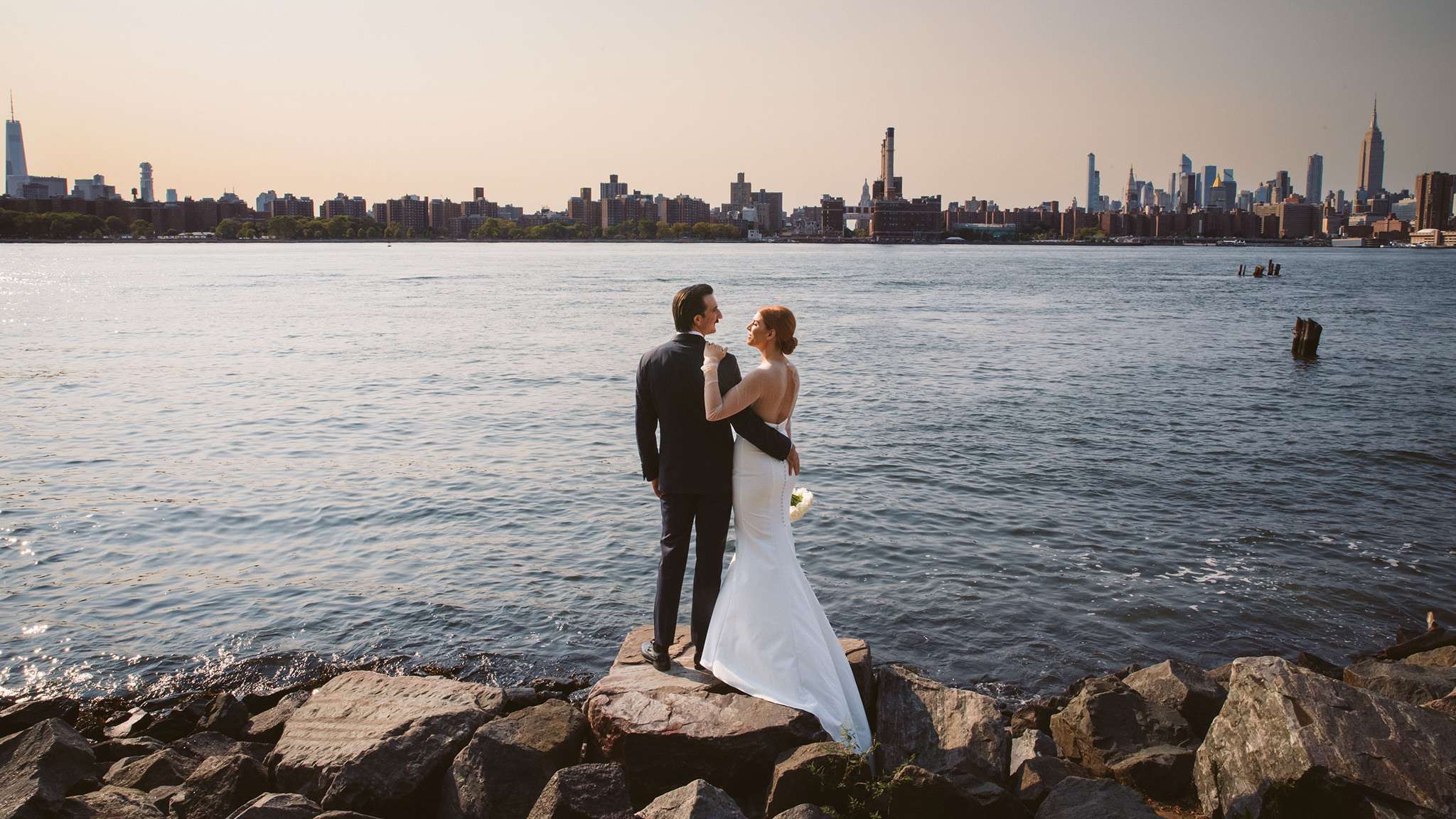 A wedding portrait in front of the New York City skyline