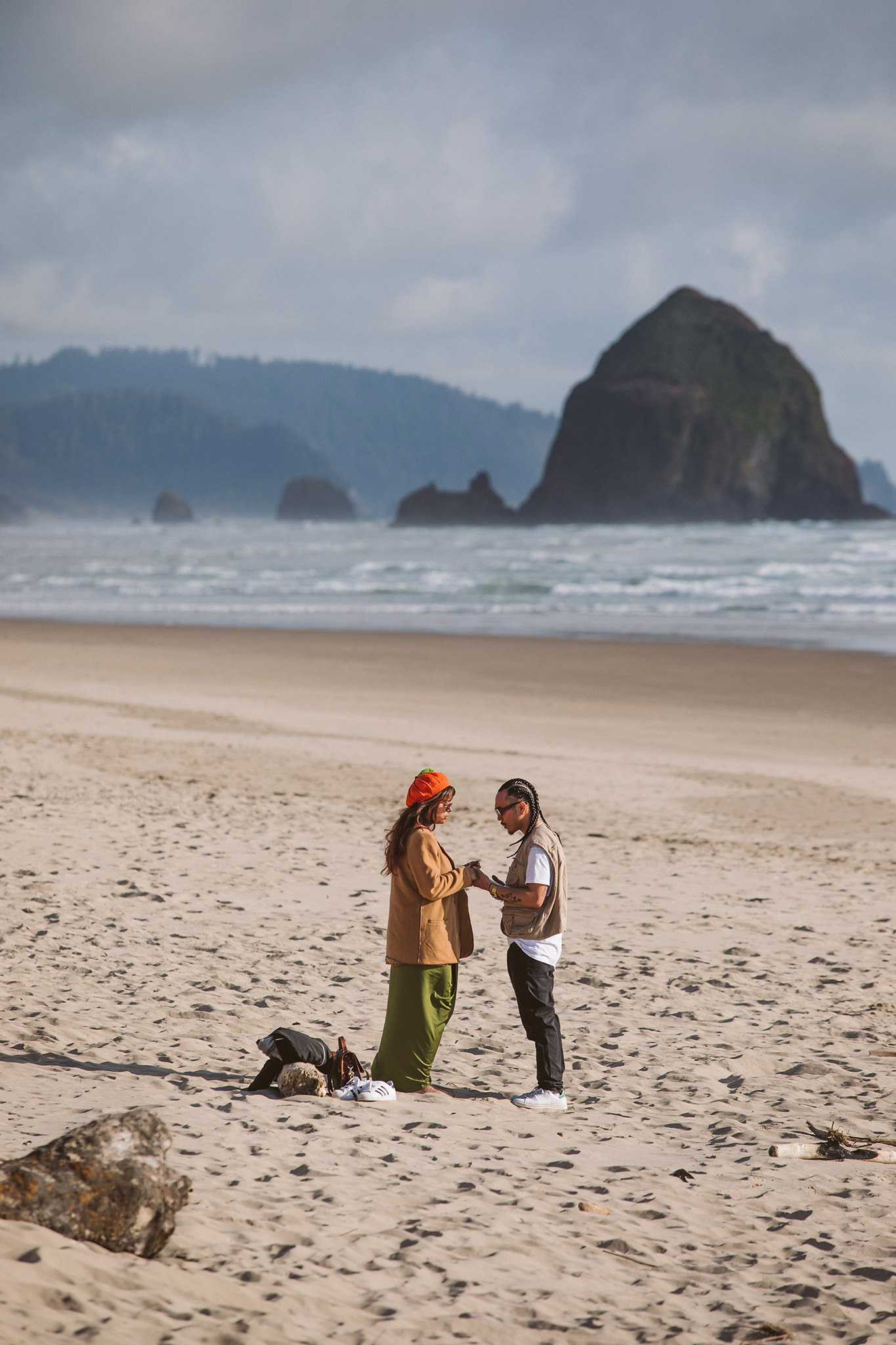 Cannon Beach surprise proposal photo in front of Haystack Rock on the Oregon coast