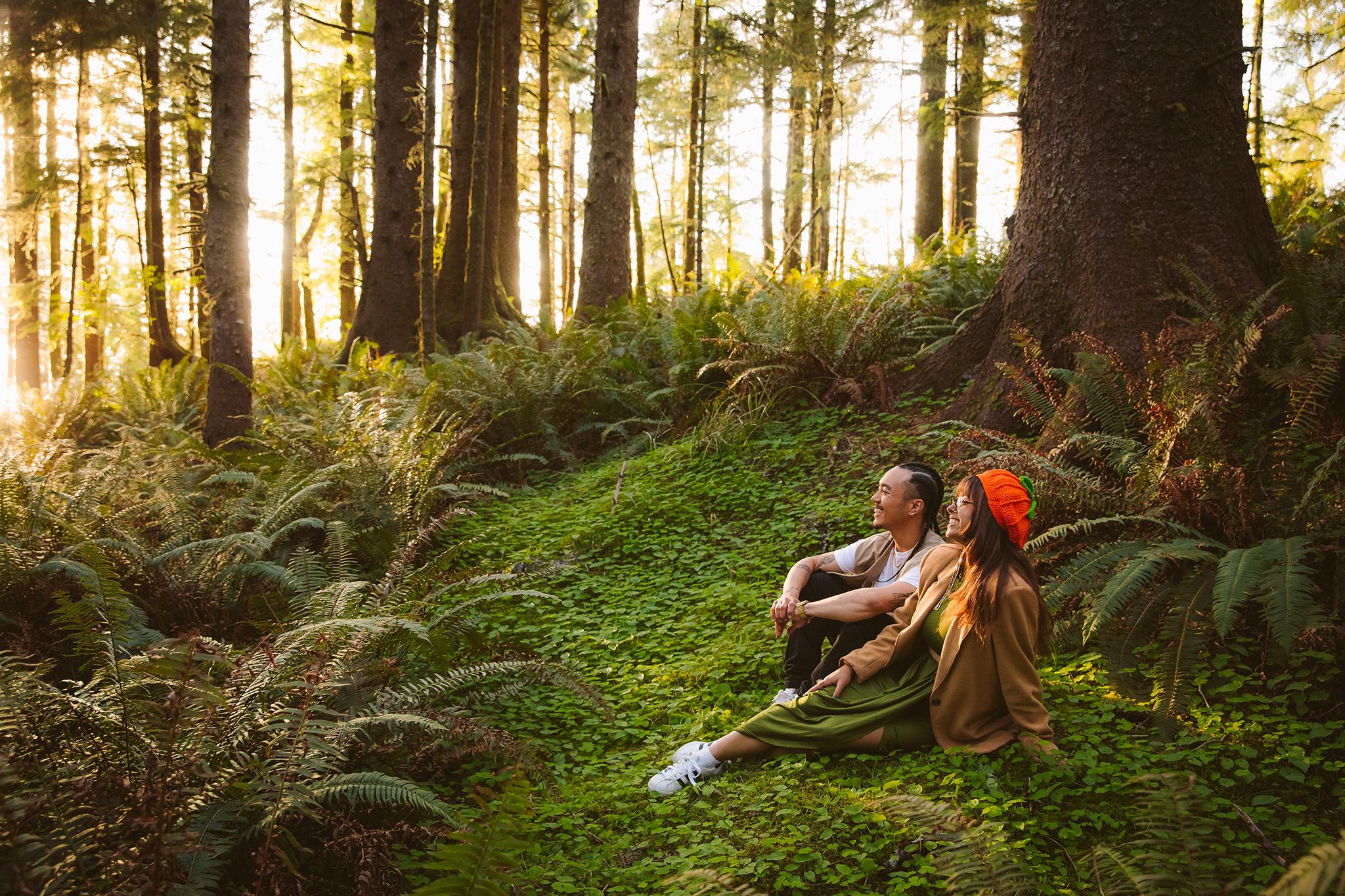 A fern filled engagement photo at Ecola State Park in Oregon