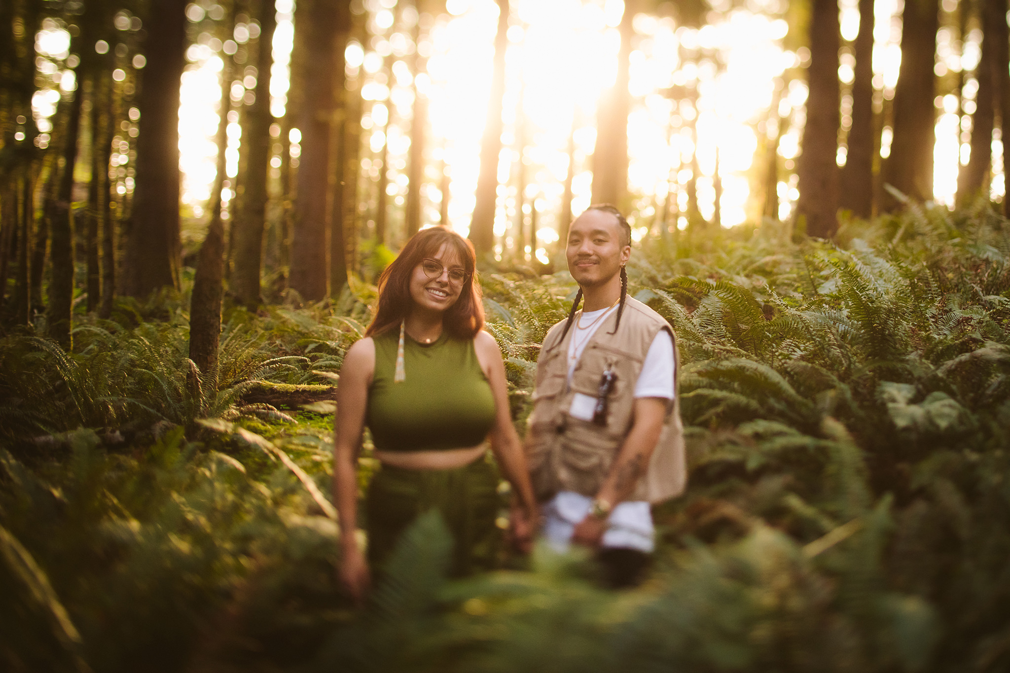 An engagement photo at golden hour in the Oregon forest