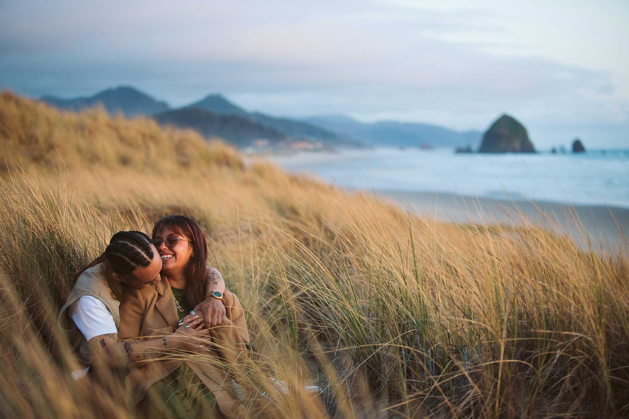 A couples photo in the sand dunes on the Oregon coast
