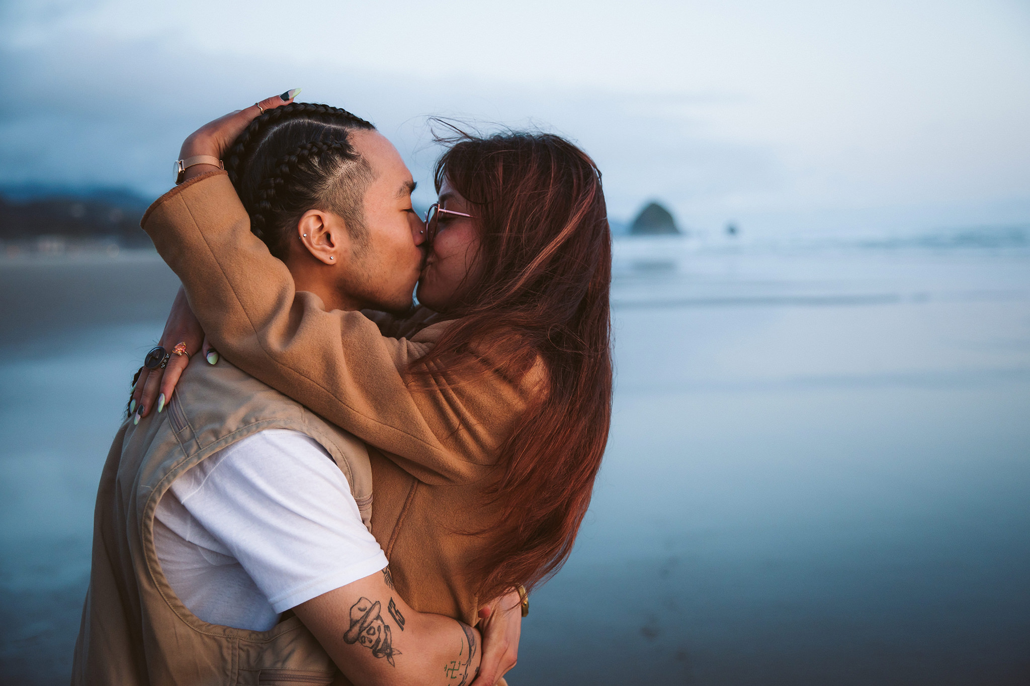 A couple kissing during their Cannon Beach proposal session