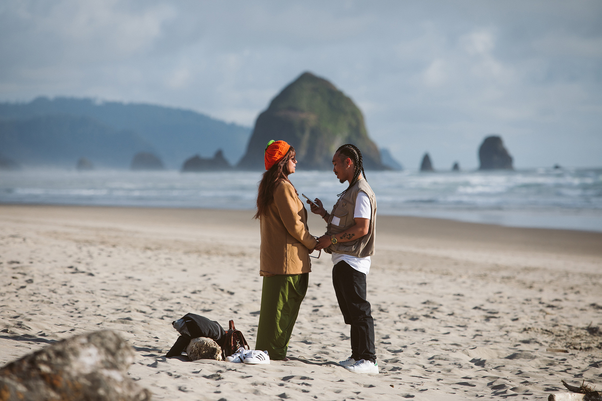 A man proposing to his girlfriend on the Oregon coast